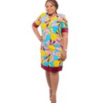 Bright yellow leaf patterns on turquoise print with burgundy hemming at sleeves and knees